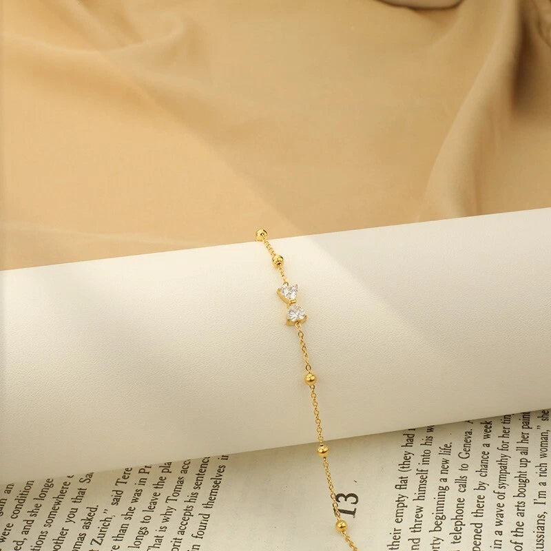 Woman 18K Gold Station Bead CZ Bow Chain Bracelet